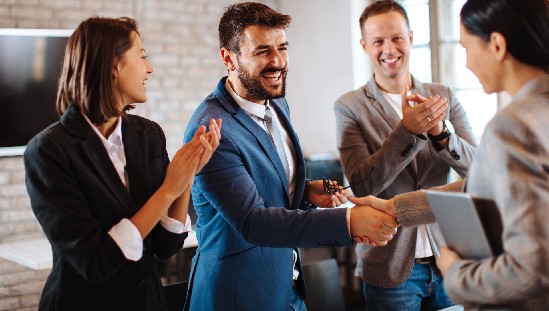 business people smiling and shaking hands